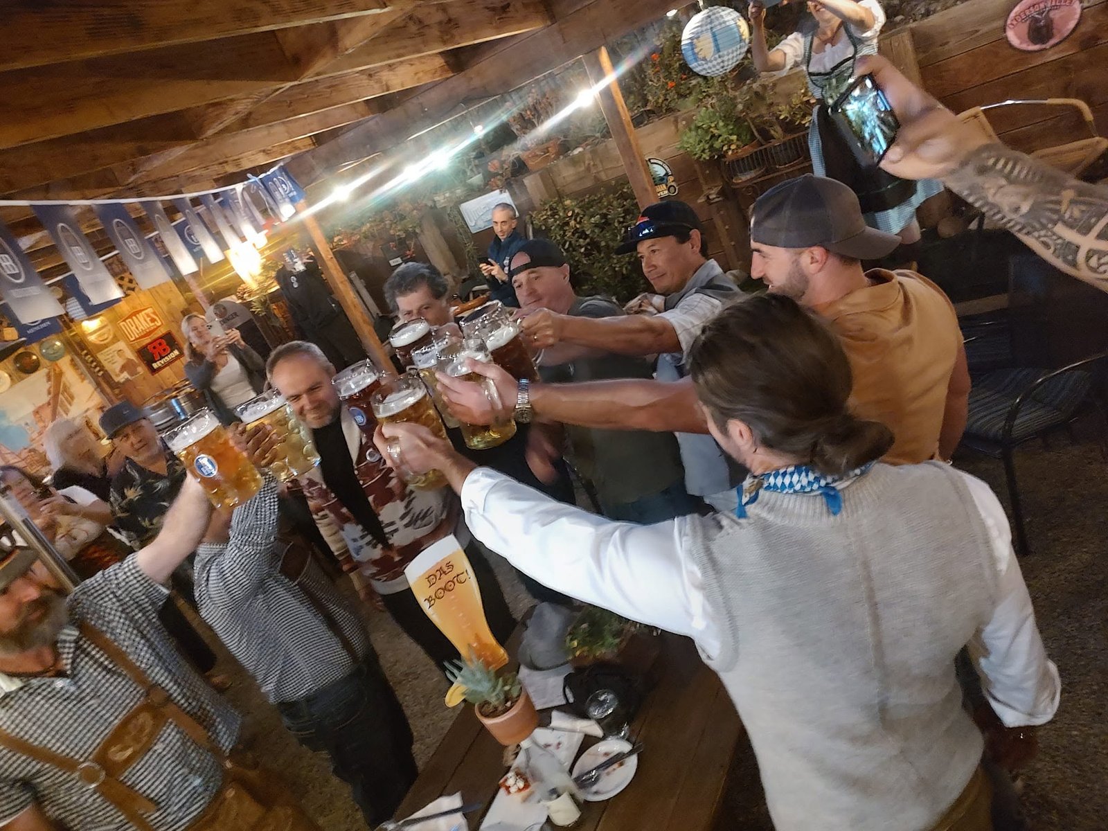 Guests raising steins during Oktoberfest in the Trailside beer garden