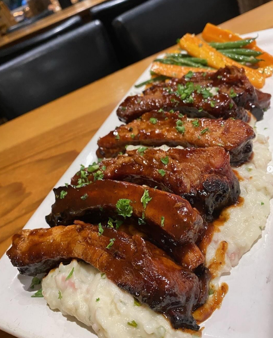 Baby back ribs over garlic mashed potatoes
